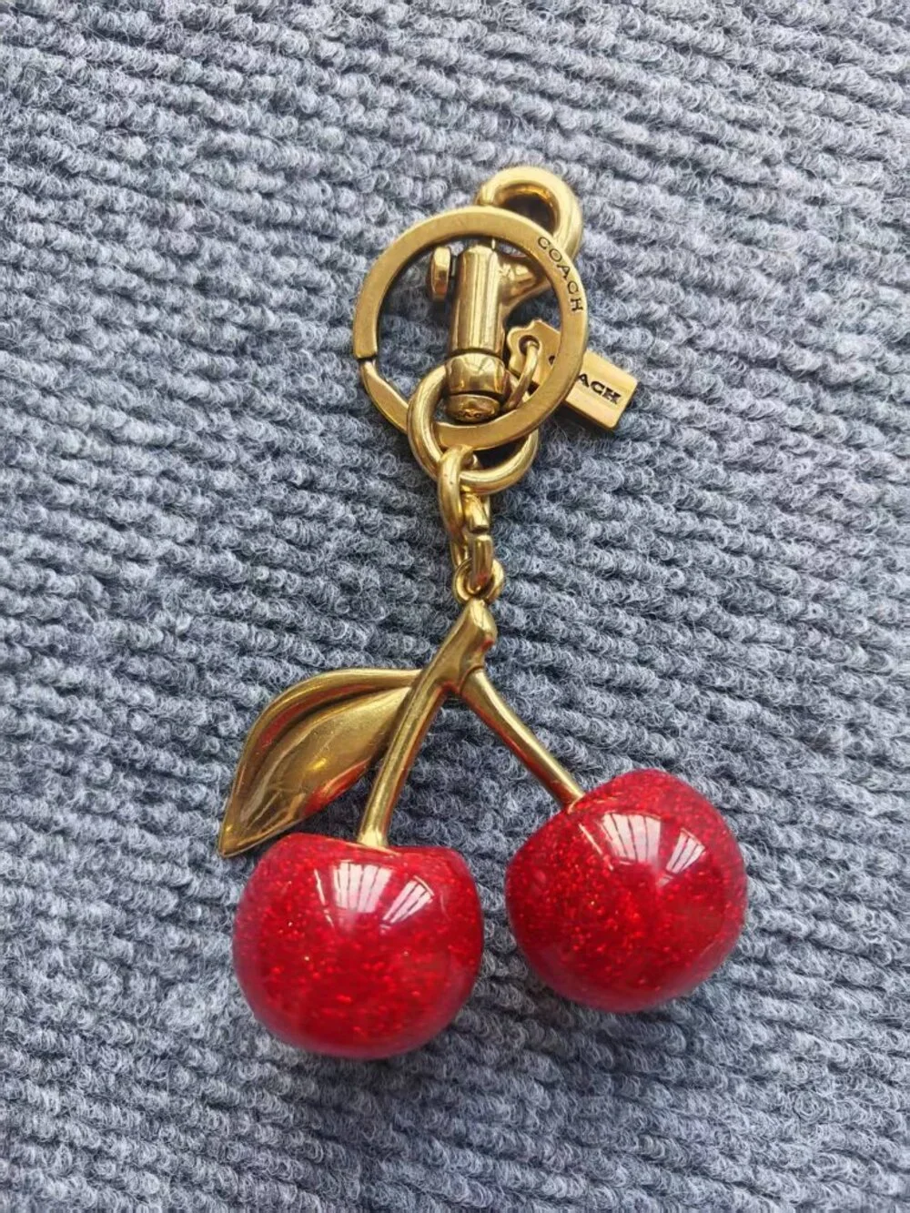 Coach Gold-Tone Cherry Key Charm with Red Glitter